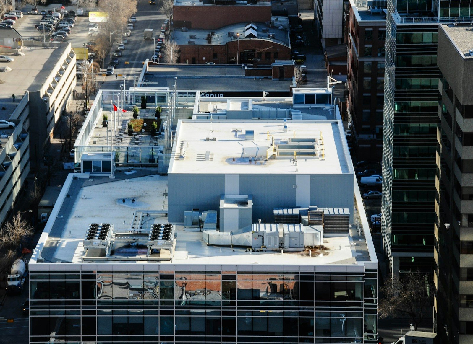 Commercial Roofing Maintenance in Greensboro: Rooftops of modern buildings in a city