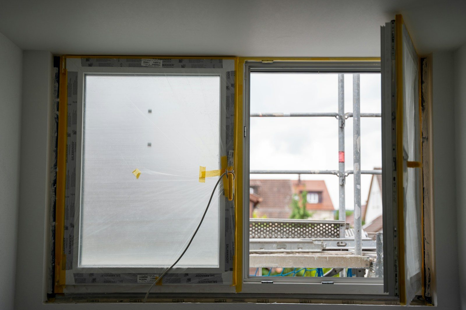 energy-efficient window replacement in Winston-Salem : Open window with construction happening outside
